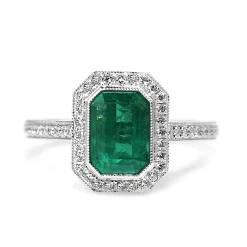 18ct White Gold Emerald and Diamond Halo Ring
