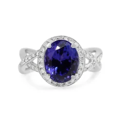 18ct White Gold Tanzanite and Diamond Halo and Twist Ring