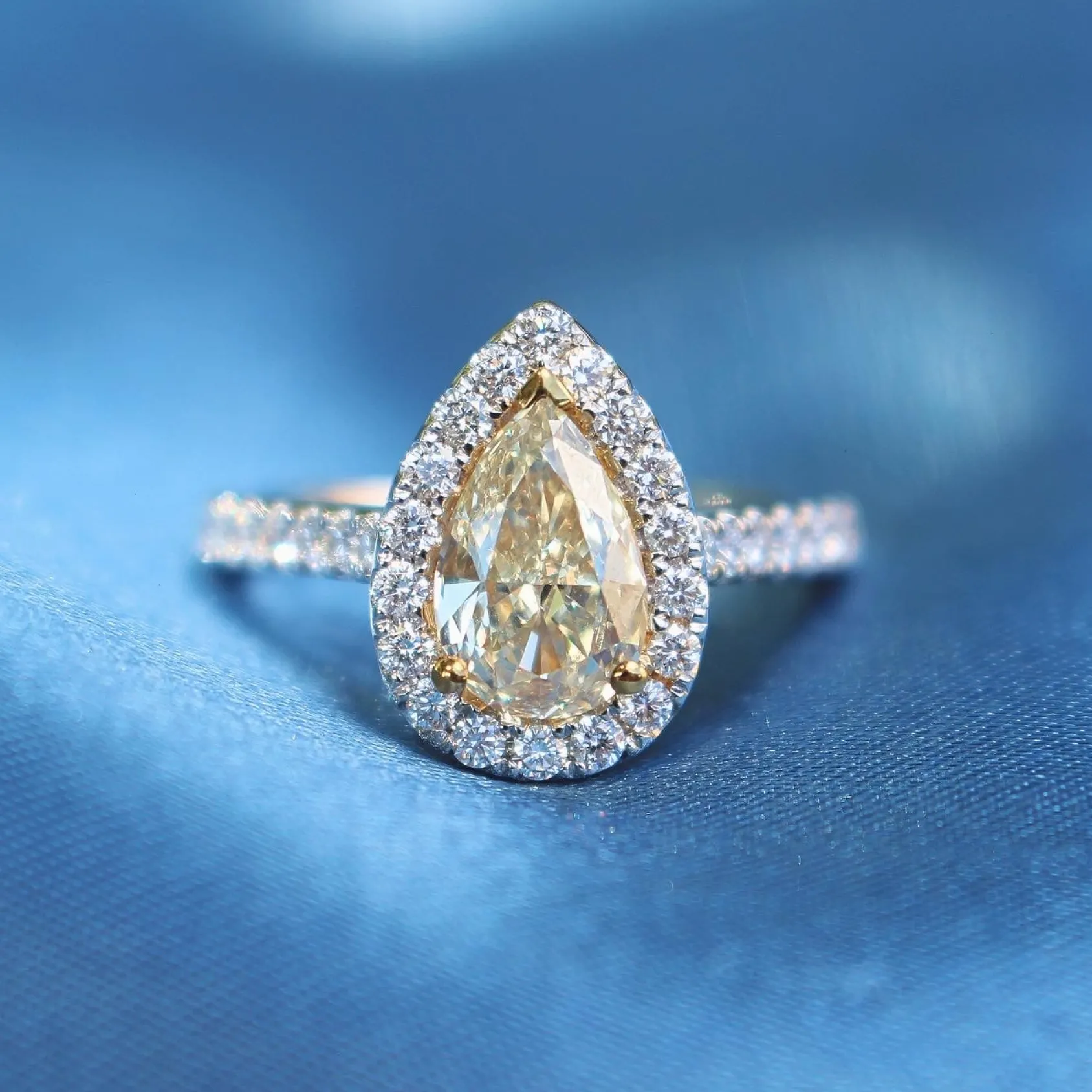 18ct Yellow and White Gold Fancy Yellow Pear Diamond Halo Ring