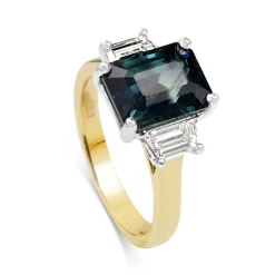 18ct Yellow and White Gold Teal/Parti Sapphire and Tapered Baguette Diamond 3 Stone Ring