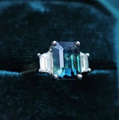 18ct Yellow and White Gold Teal/Parti Sapphire and Tapered Baguette Diamond 3 Stone Ring